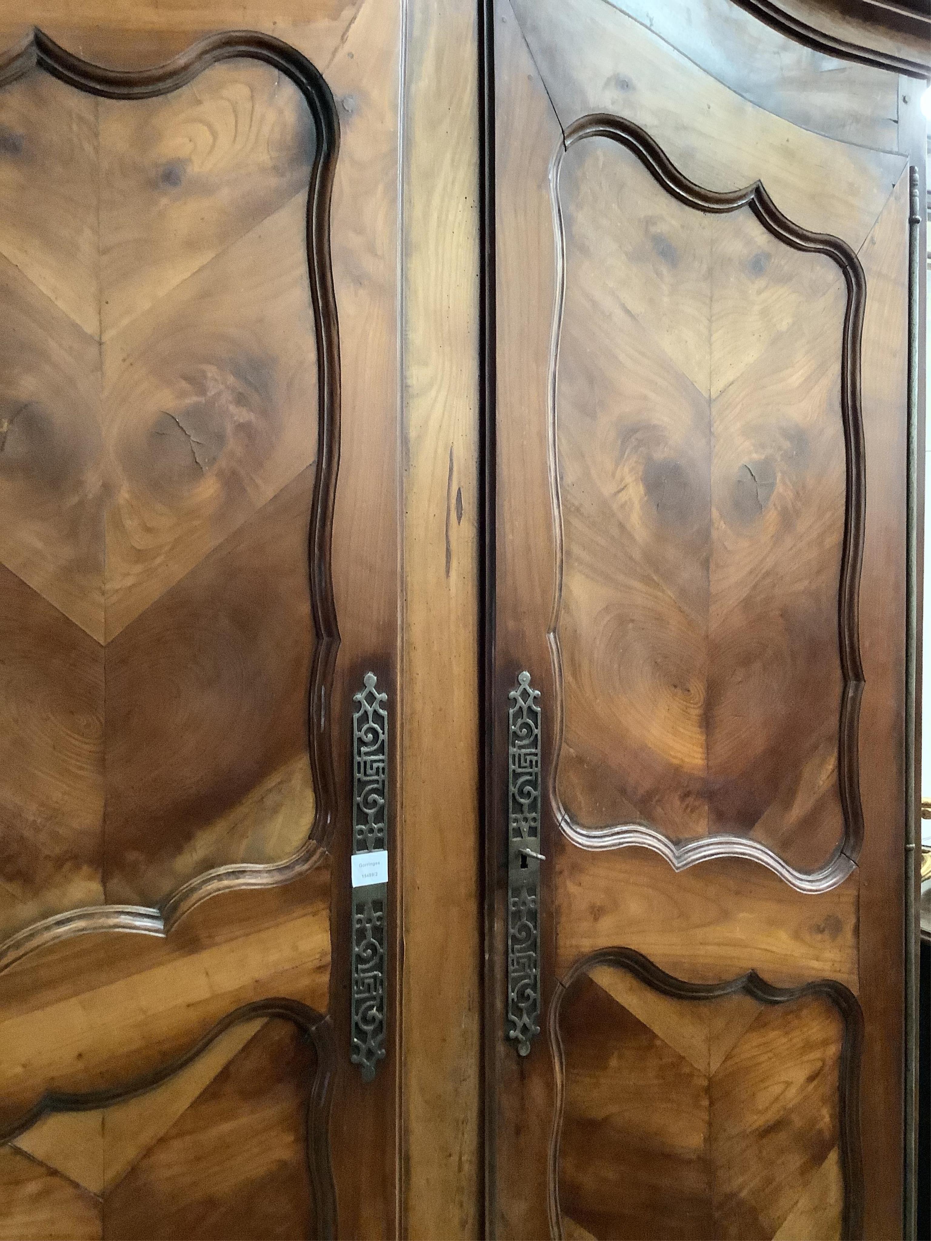 An 18th century French walnut armoire, width 150cm, depth 69cm, height 224cm. Condition - fair